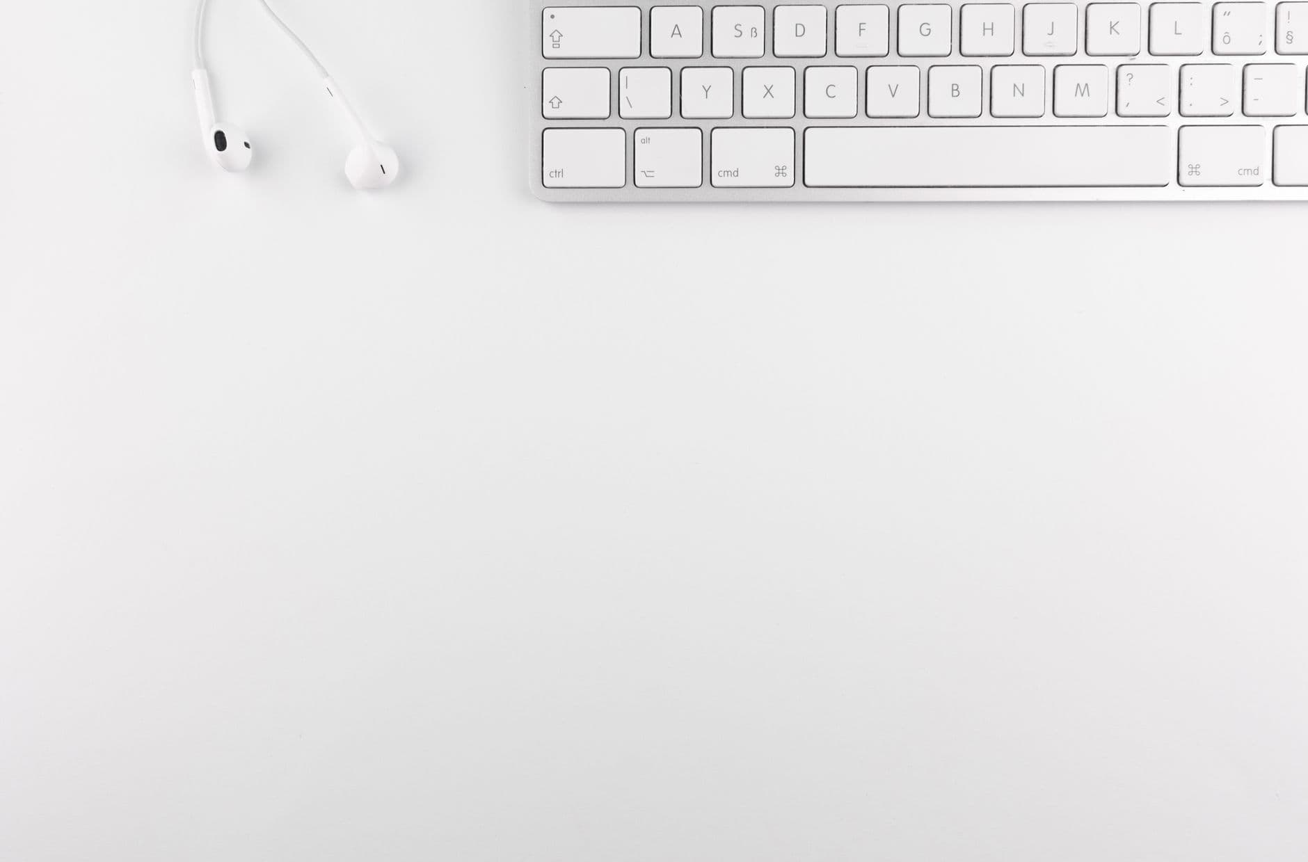 A tidy white desk seen from above